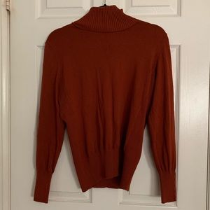 Rust orange turtleneck sweater